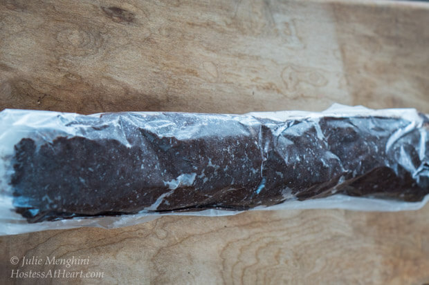 Chocolate cookie dough rolled in a log and then wax paper.
