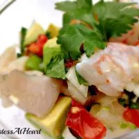 Close up of shrimp ceviche in a glass dish.