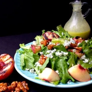 Salad with grilled peach half