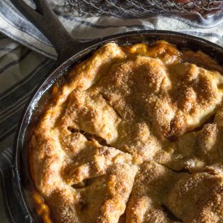 Beautiful rustic Skillet Apple Pie has a buttery crust that's filled with a delicious warm cinnamon-apple filling. - HostessAtHeart.com