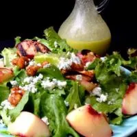 Salad with grilled peach half