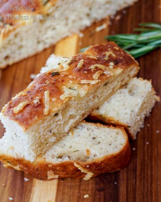 3 slices of easy focaccia bread recipe stacked on a cutting board | Hostess At Heart