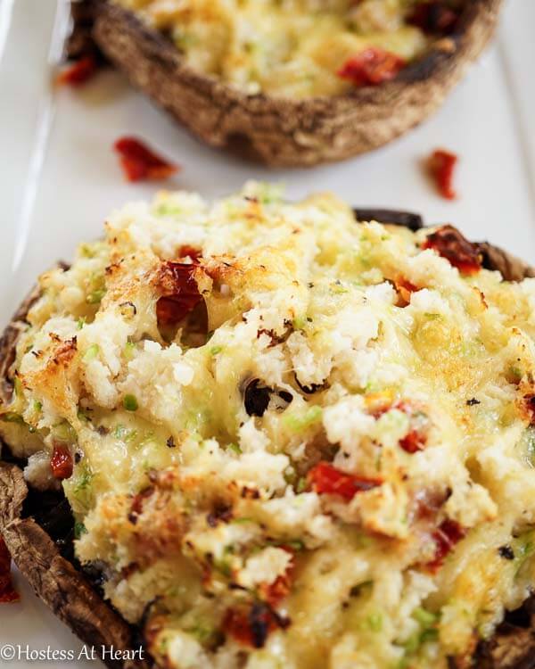 A portobello mushroom stuffed with crab and Havarti then garnished with grated cheese.