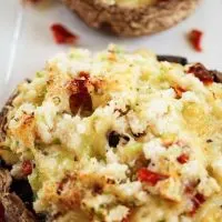 A portobello mushroom stuffed with crab and Havarti then garnished with grated cheese.