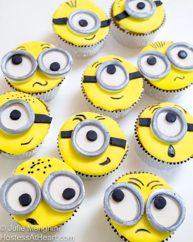 Top-down view of cupcakes decorated to look like minions.