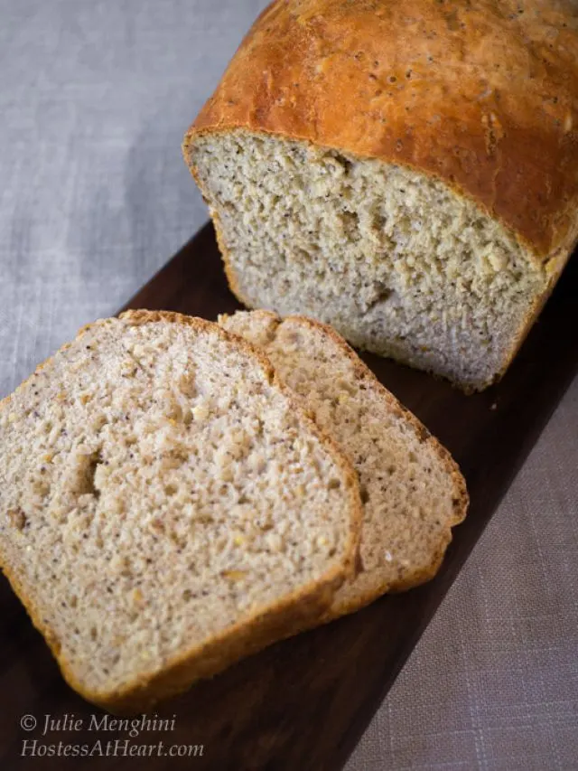 Sideview of a sliced loaf of bread with the front slices laying on their sides | Hostess At Heart