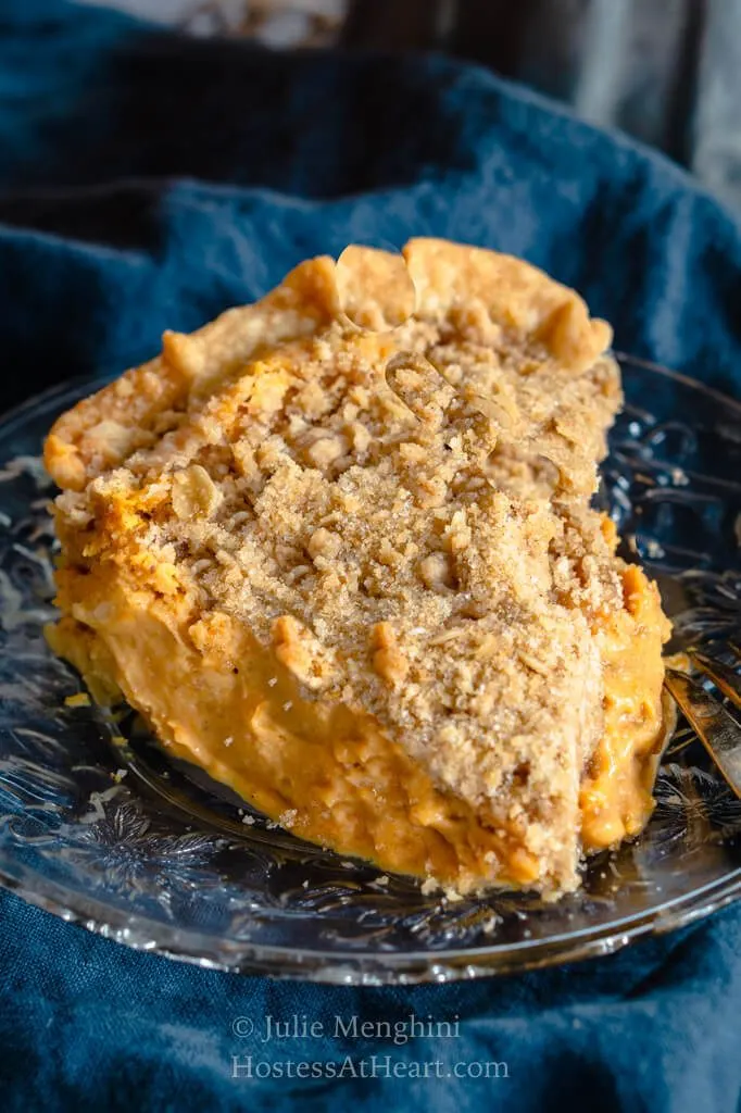 close-up top view of slice of pumpkin cheesecake pie