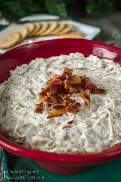 Caramelized Onion and Bacon Dip in a red bowl