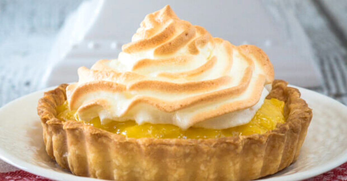 Table view of a pineapple tart topped with meringue