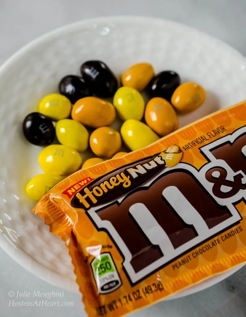 M&M's® Honey Nut Cookies taste like a big ole hug. They are warm from the fresh honey and the delicious flavor of the M&M's® Honey Nut candy gives these cookies a sweet nutty flavor | HostessAtHeart.com