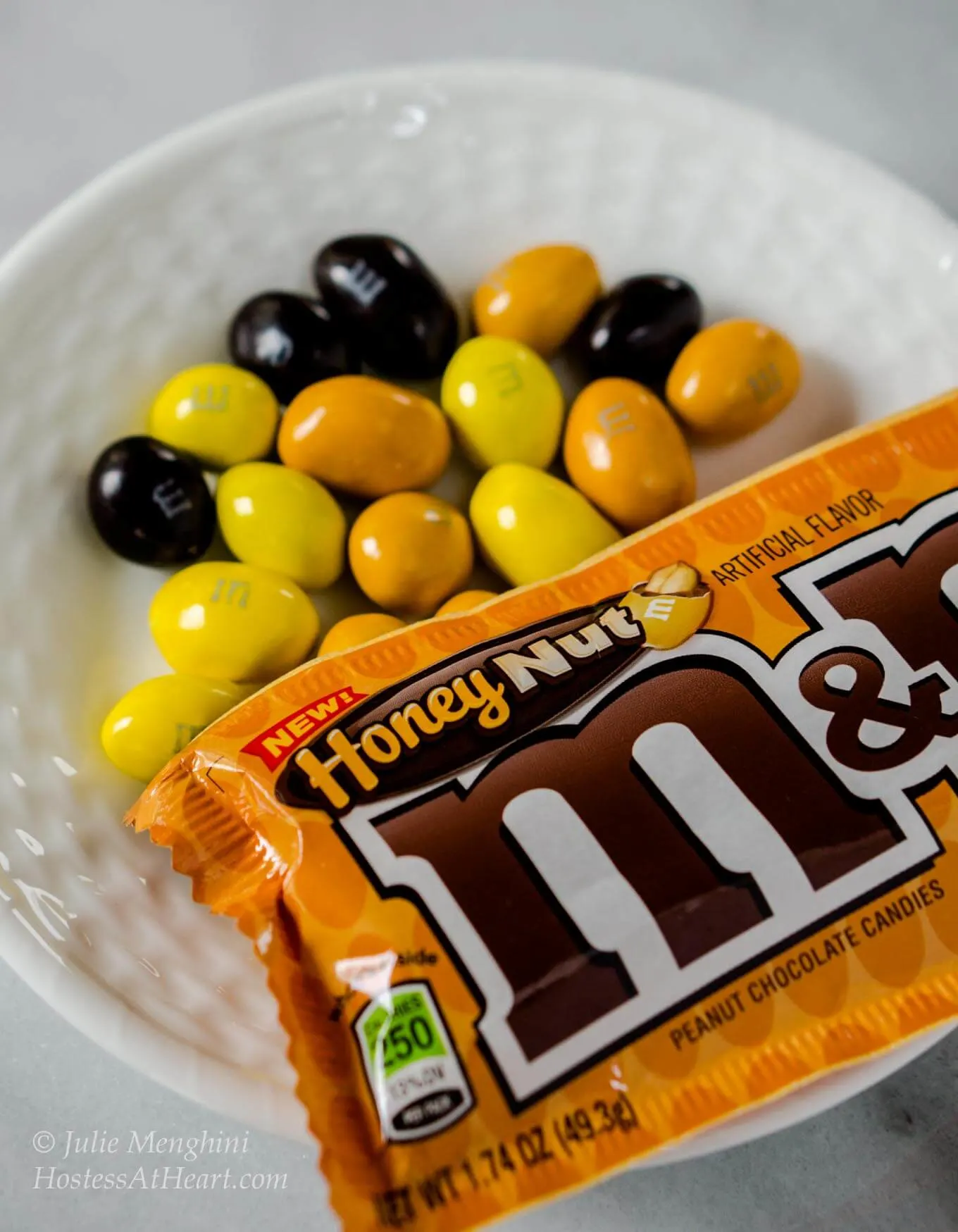 M&M's® Honey Nut Cookies taste like a big ole hug. They are warm from the fresh honey and the delicious flavor of the M&M's® Honey Nut candy gives these cookies a sweet nutty flavor | HostessAtHeart.com