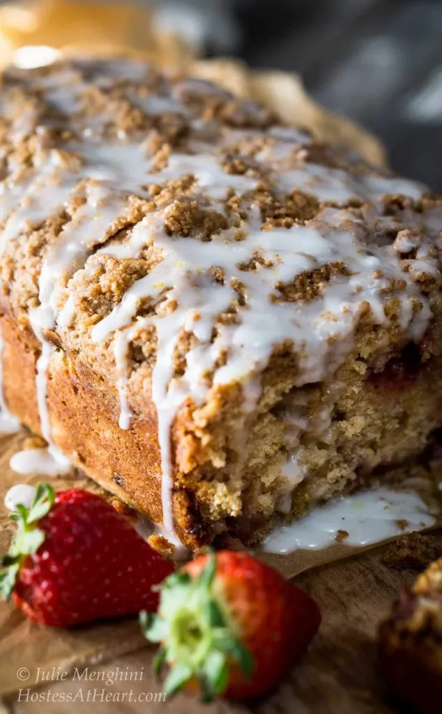 Strawberry Rhubarb Bread with Streusel Topping could easily pass for cake. It is sweet, tart and crunchy all at the same time. It's perfect for anytime from breakfast to dessert | HostessAtHeart.com