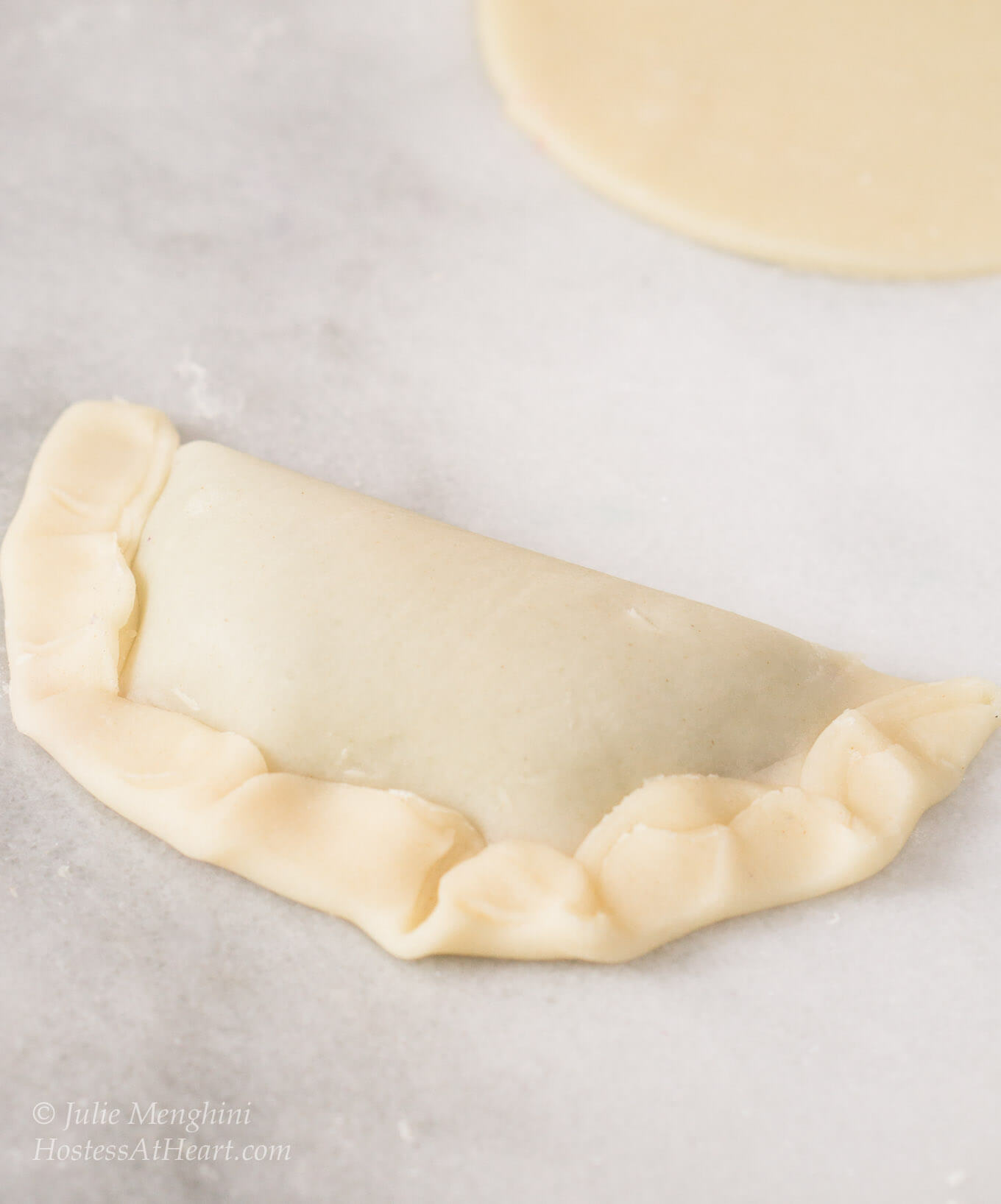 Filled hand pies folded over and crimped.