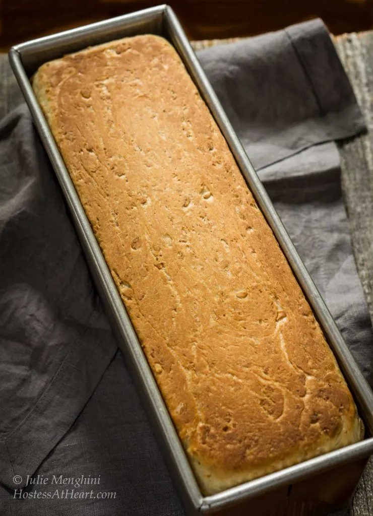 Top-down view of a loaf of Honey Oat bread sitting in a Pain de Mie bread pan.