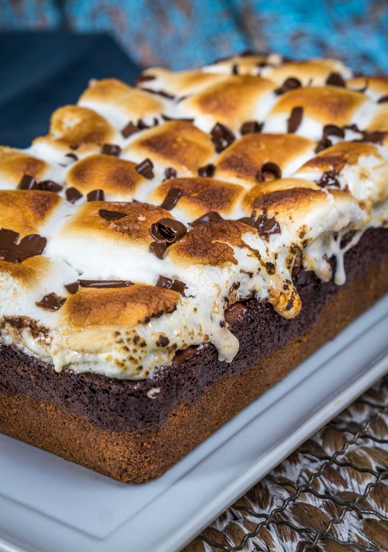 An angled photo of the full S\'mores dessert sitting on a white serving plate.