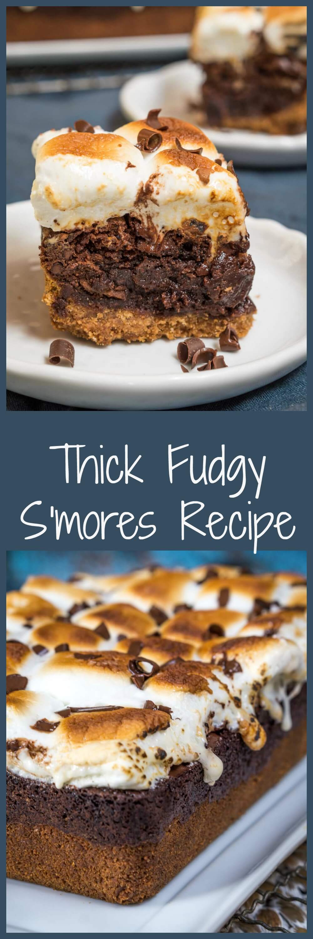Two photo collage for Pinterest with the title \"Thick Fudgy S\'mores Recipe\" running through the center. The top photo is Sideview of a piece of S\'mores chocolate dessert with a bottom layer of graham cracker under a layer of chocolate and topped with toasted marshmallow sitting on a white plate over a blue napkin. A second plate sits in the background. The bottom photo is an angled photo of the full S\'mores dessert.