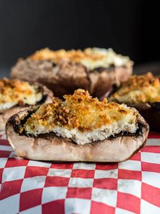 A Crab-Stuffed Mushroom baked and cut in half showing the layers.