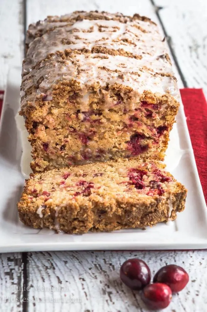 Cranberry Apple Streusel Bread has a delicious soft center dotted with cranberry and apple. This bread is topped with a thick cinnamon brown sugar streusel. | HostessAtHeart.com