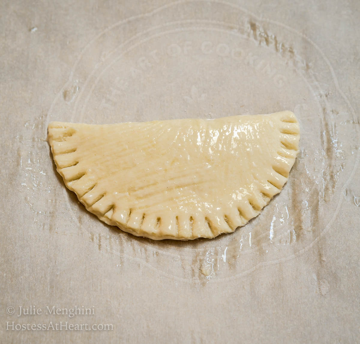 Dark Chocolate Puff Pastry Hand Pies have a light, airy and soft interior enhanced by a deep dark chocolate. The whole thing is wrapped in a golden brown Puff Pastry with a delicate crunch. | HostessAtHeart.com