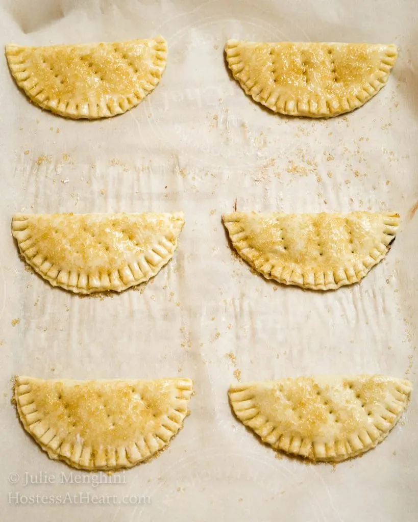 Dark Chocolate Puff Pastry Hand Pies have a light, airy and soft interior enhanced by a deep dark chocolate. The whole thing is wrapped in a golden brown Puff Pastry with a delicate crunch. | HostessAtHeart.com