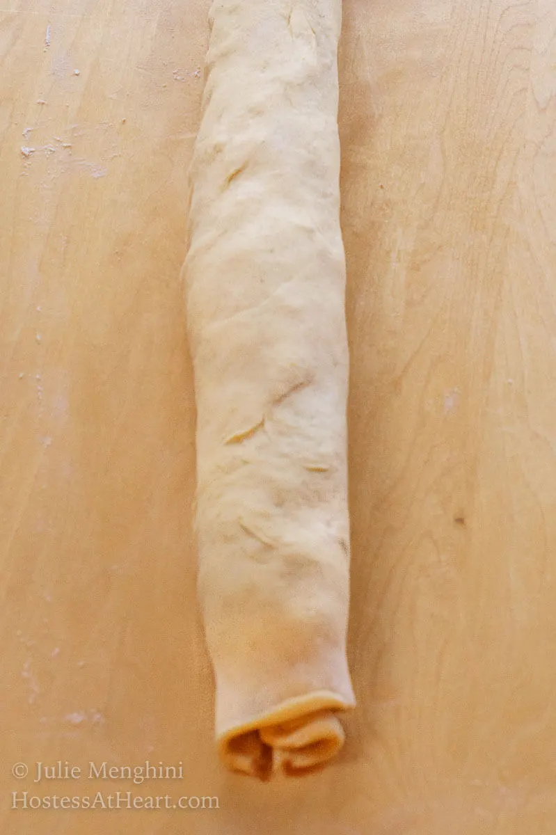 Dough filled with cinnamon filling and rolled into a log - HostessAtHeart.com