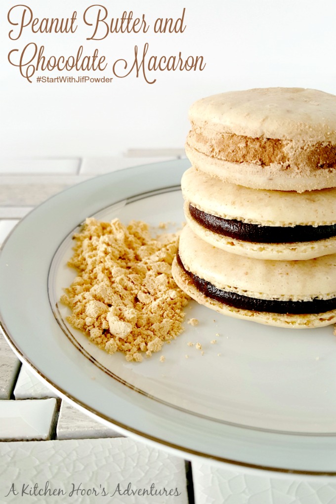 A stack of 3 chocolate macarons.