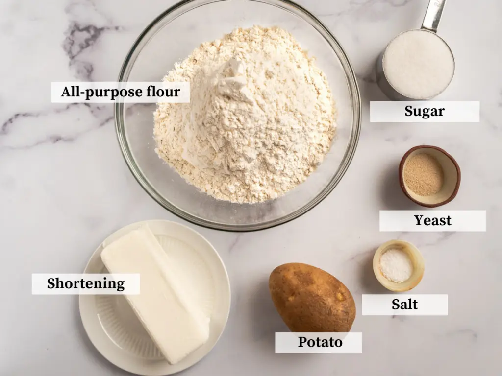 Ingredients used to make potato rolls including flour, shortening, salt, potato, sugar, and yeast