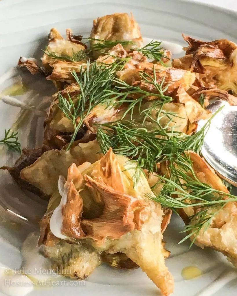 Roasted fennel garnished with fennel fronds.