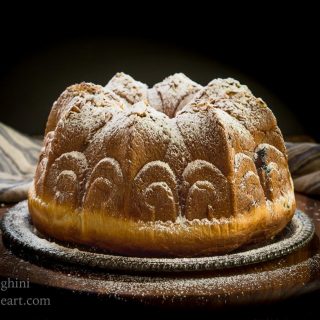 Table view of a Cherry Almond Kugelhopf dusted with powdered sugar.