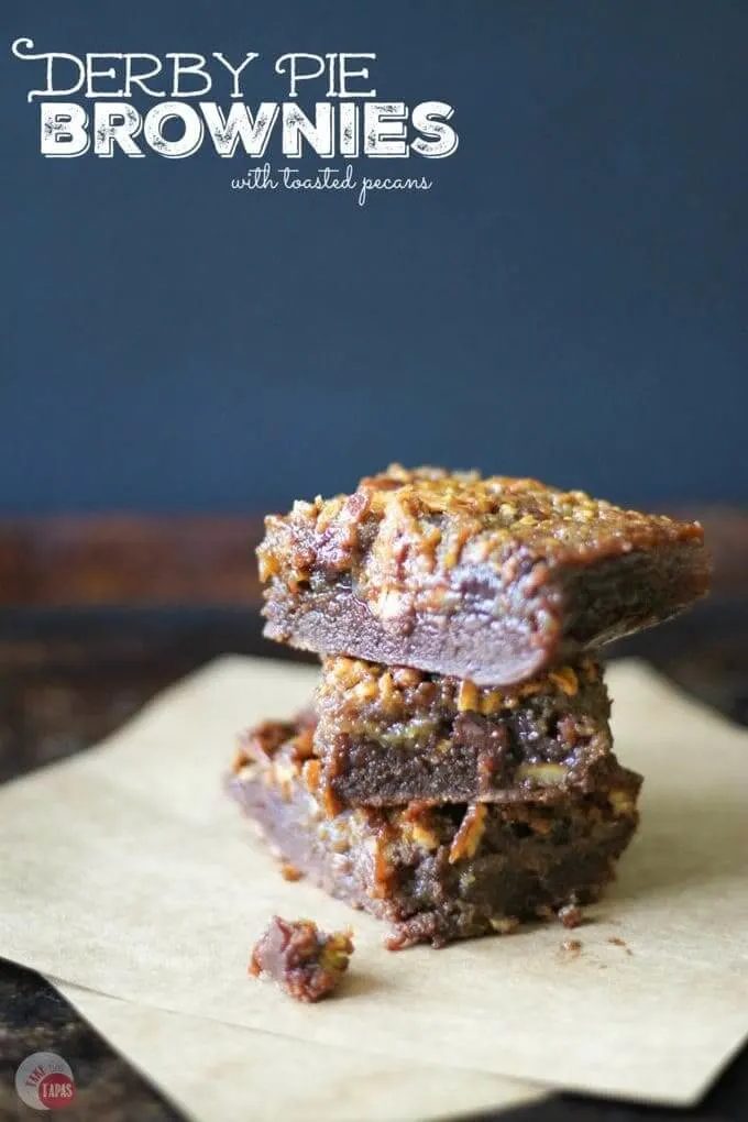 Stacked chocolate bars on a piece of parchment paper.