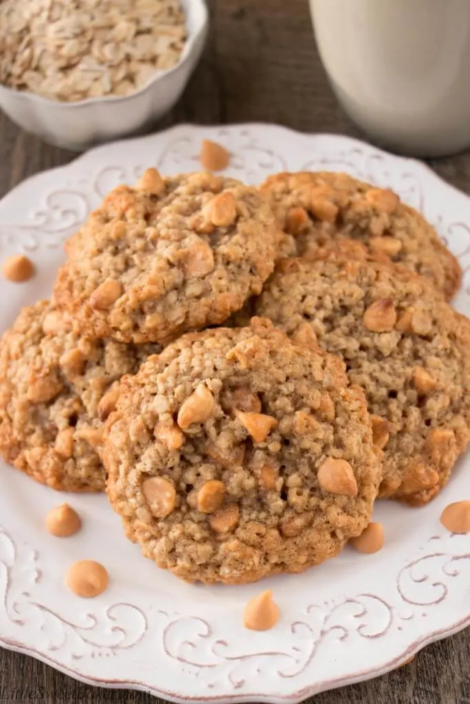 A white plate of butterscotch chip cookies.