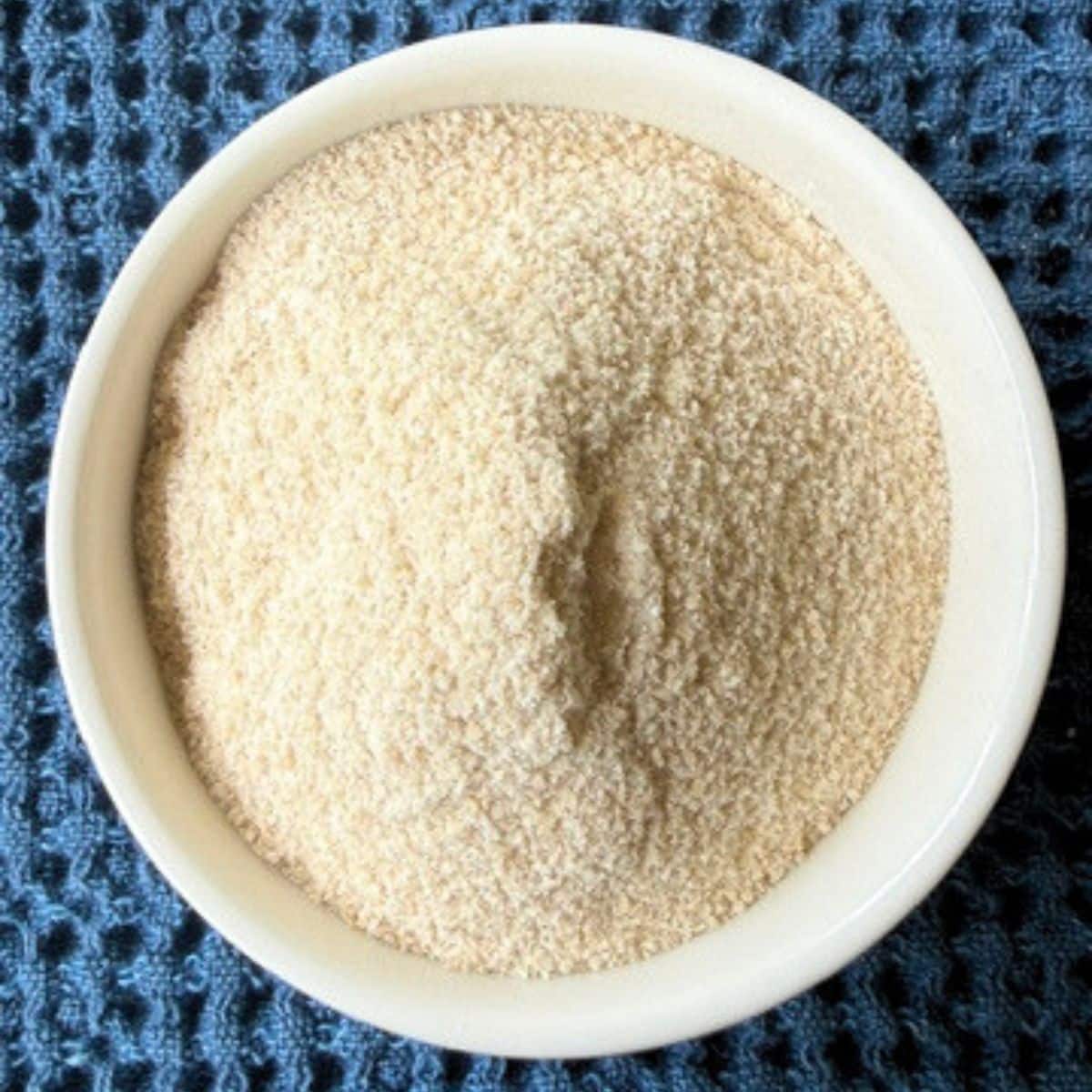 A white bowl filled with Turbinado sugar that's been ground to the texture of fine sand. Hostess At Heart