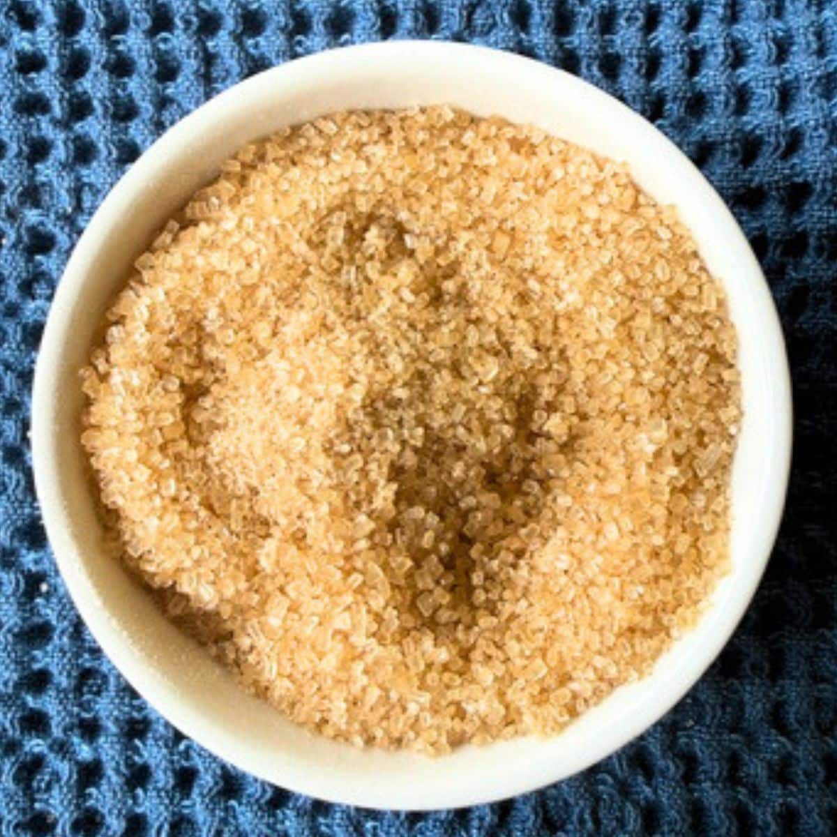 A bowl filled with coarse turbinado sugar for zucchini bread. Hostess At Heart