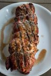 Grilled Pork Tenderloin with Peach Rum Sauce sounds pretty decadent but is easy to prepare, perfect for entertaining and absolutely delicious to eat! HostessAtHeart.com