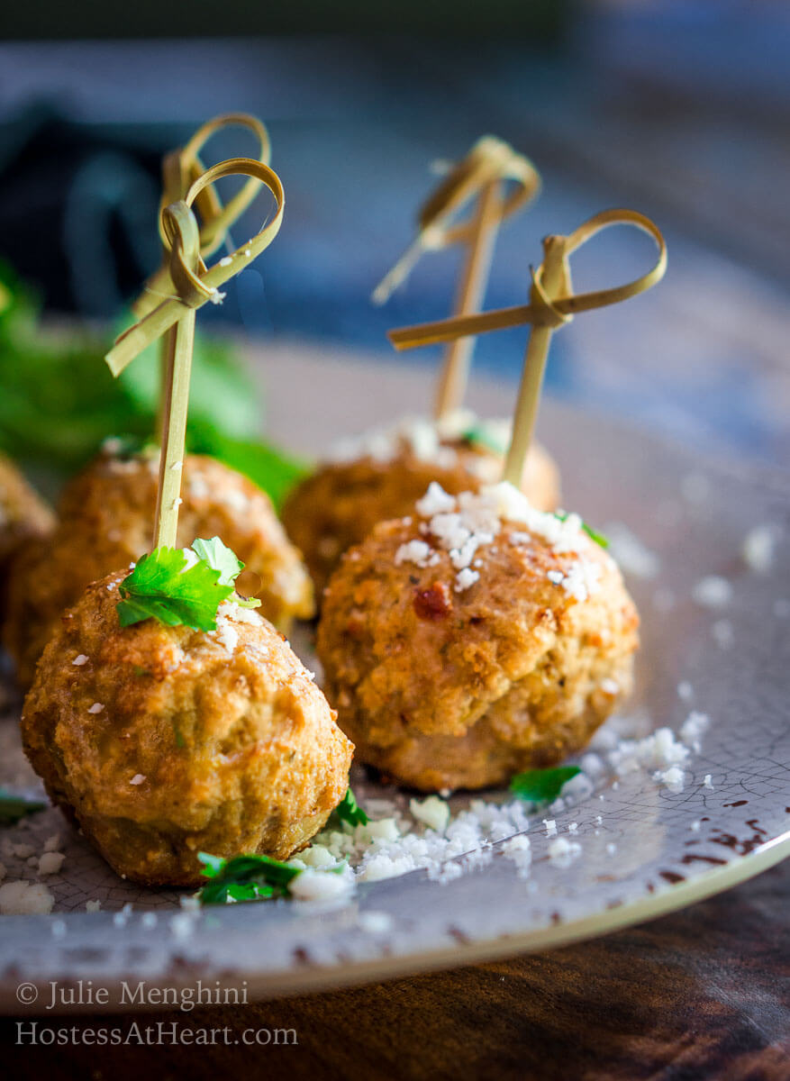 Baked Turkey Meatballs with Green Chiles are perfect as an appetizer, topping a southwest salad or even stuffed in a hoagie. They're perfect for any time of year but especially tailgating! | HostessAtHeart.com