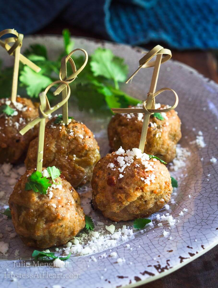 Baked Turkey Meatballs with Green Chiles are perfect as an appetizer, topping a southwest salad or even stuffed in a hoagie. They're perfect for any time of year but especially tailgating! | HostessAtHeart.com