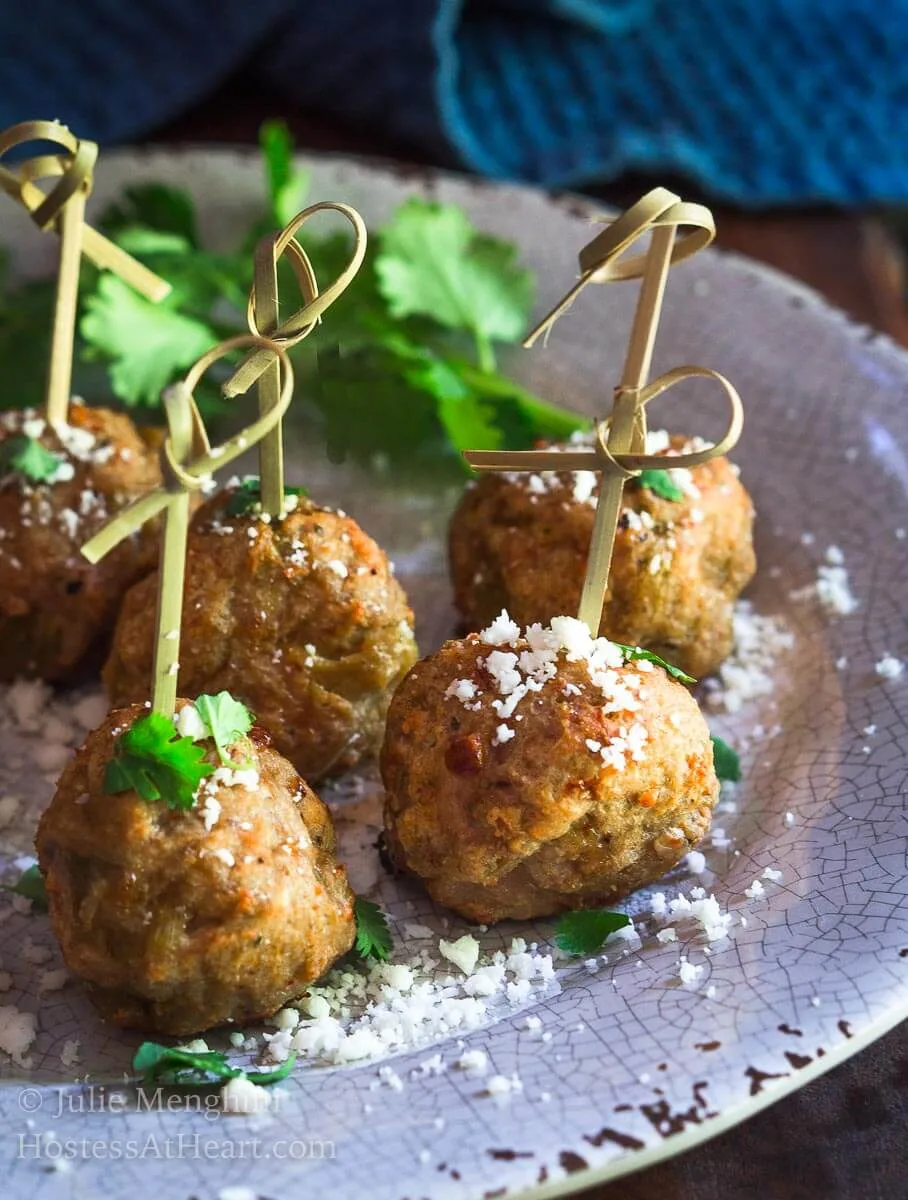 Baked Turkey Meatballs with Green Chiles are perfect as an appetizer, topping a southwest salad or even stuffed in a hoagie. They're perfect for any time of year but especially tailgating! | HostessAtHeart.com