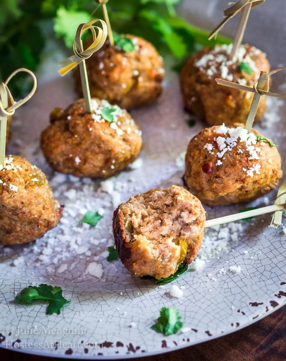 Baked Turkey Meatballs with Green Chiles are perfect as an appetizer, topping a southwest salad or even stuffed in a hoagie. They're perfect for any time of year but especially tailgating! | HostessAtHeart.com