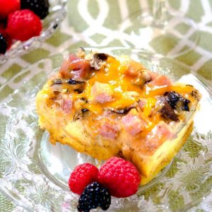 This Ham and Cheese Mushroom Strata Recipe is easy and can be made ahead which makes it perfect for entertaining and the holidays! | HostessAtHeart.com
