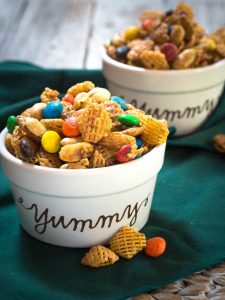 This Addictive Caramel Crispix Snack Mix is so good that people will ask you not to make it.  One batch will keep you and a ton of your friends munching all day long! | HostessAtHeart.com