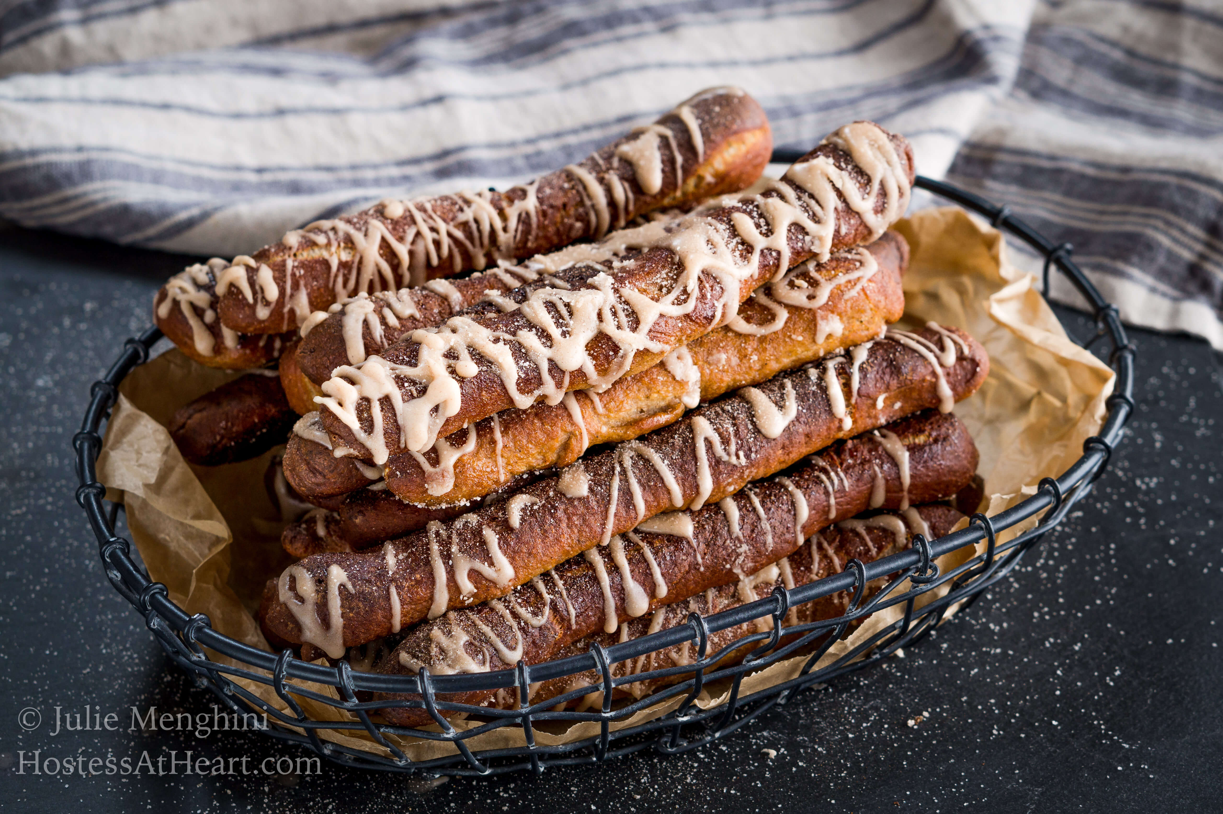 Cinnamon Sugar Soft Pretzel recipe is a made with a pretzel dough slightly sweetened with brown sugar and warm cinnamon and finished with a cinnamon glaze drizzle. | HostessAtHeart.com Cinnamon Sugar Soft Pretzel Recipe