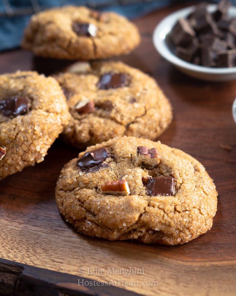 Three cookies lines up in a row with one cookie laid off to the side.