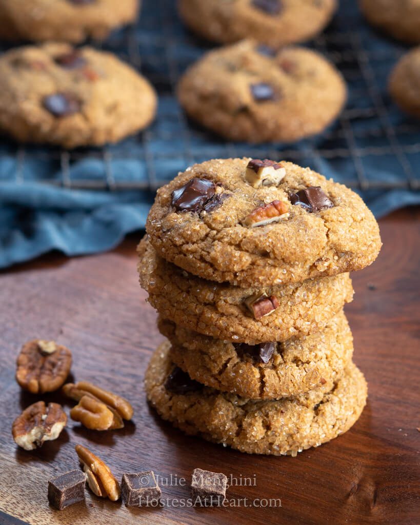 Stack of 4 cookies in front of a tray of cookies.