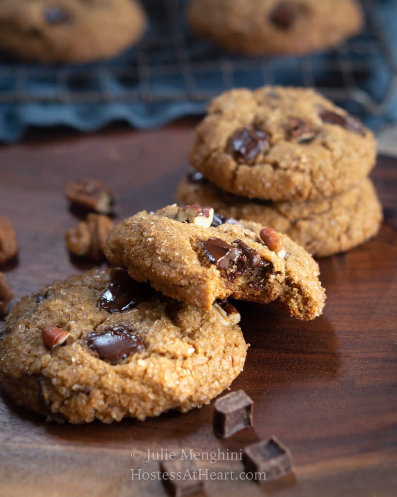 Three cookies with a bite out of the middle one.