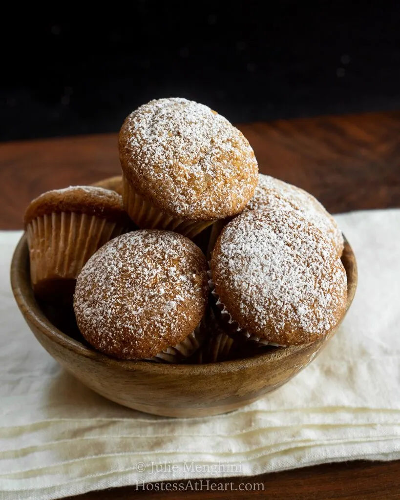 Wooden bowl filled with muffins