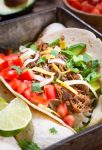 3/4 view of a pulled pork taco angled to the right