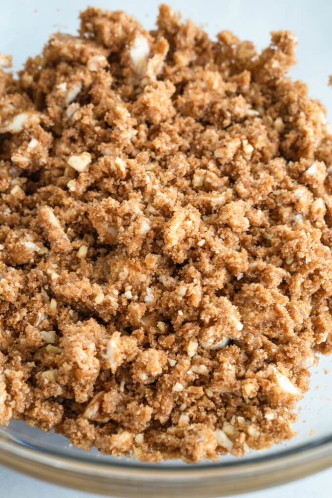 Close up of streusel showing crumbly pea-sized pieces of butter mixed with brown sugar and cinnamon.