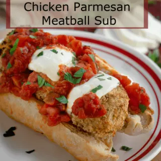 A hoagie roll loaded with fresh marinara, melted mozzarella over chicken parmesan meatballs