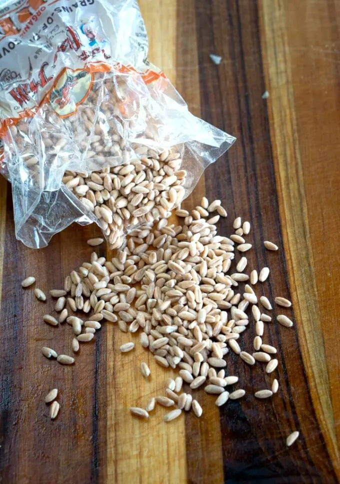 Farrow spilling out of the bag onto a wooden cutting board.