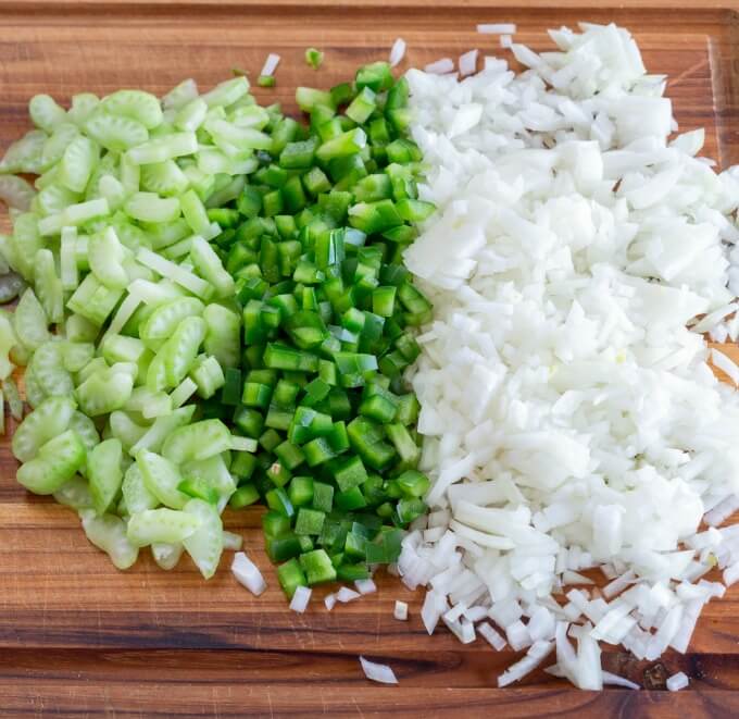 Ingredients for Jambalaya including chopped green pepper, celery, and onion.
